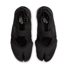 The Nike Air Rift "Triple Black" harkens back to the '90s with its unique and iconic silhouette, taking inspiration from Kenyan runners who trained in bare feet. Originally released in 1996, the shoe is now updated with a sleek Triple Black aesthetic to add versatility to your wardrobe. The upper features synthetic materials for a lightweight design and there's even Swoosh branding on both toes and the insole for subtle touch of style. It wouldn't be complete without a Phylon midsole that offers superior comfort as well as lightweight cushioning underfoot. With straps that help ensure a secure fit and an ankle collar for added support, this shoe will deliver optimal comfort without compromising on performance or style. So treat your feet to something special: it's time to lace up the Nike Nike Rift, Nike Air Rift, Latest Sneakers, Triple Black, Sport Sandals, Sandals Black, Nike Sneakers, Shoes Nike, Black Aesthetic