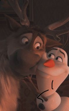 an animated character kissing another character with antlers on his head in the disney movie frozen princess