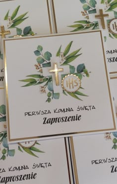 several greeting cards with cross and olives on them, all printed in gold foil