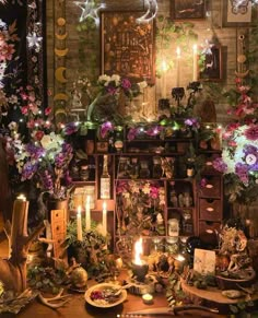 a table topped with lots of flowers and candles