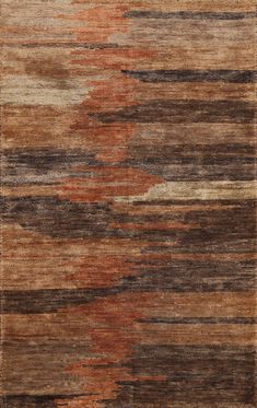 an area rug with different colors and patterns on it, including brown, beige, orange and