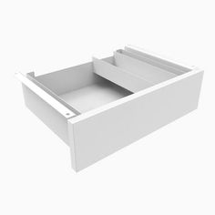 an open drawer with two compartments on the bottom and one section in the middle, against a white background