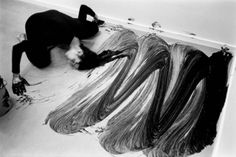 a woman laying on the floor next to some hair