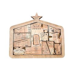 the wooden puzzle is shaped like a house