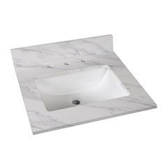 a white sink sitting on top of a marble counter