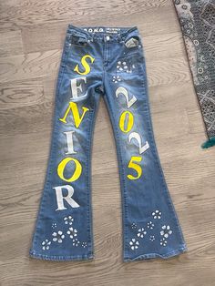 senior jeans ideas, senior jeans painting, high school, senior year #senioryear Senior Jeans Red White And Blue, Senior 2025 Jeans, Senior Themes, Senior Jeans Ideas, Spirit Jeans Ideas, Senior Jeans Ideas High Schools, Senior Pants Ideas, Senior Jeans Painted, Decorating Jeans