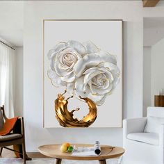 a living room with white furniture and a painting on the wall over a coffee table