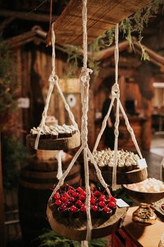 the food is being served on the wooden trays with rope hanging from it's sides