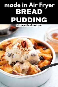 a bowl filled with bread pudding topped with pecans and whipped cream, on top of a blue counter