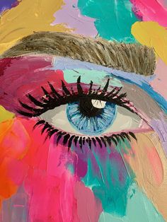 an eye painted on canvas with multicolored paint