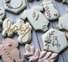 decorated baby shower cookies on a table