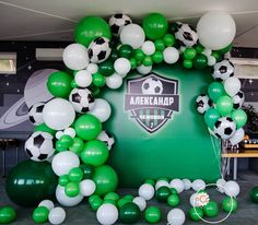 soccer themed balloon arch with green and white balloons