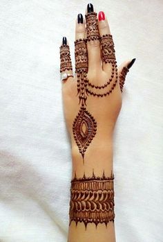 a woman's hand with henna on it and the words explore written in arabic