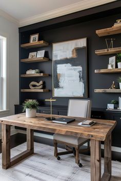 an office with black walls, shelves and a wooden desk in front of a window