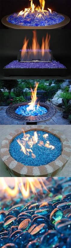 an outdoor fire pit surrounded by water and rocks, with flames coming from the top