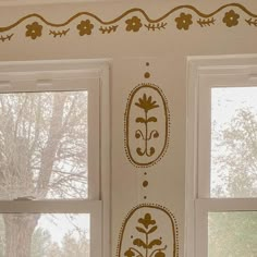 the window sill is decorated with decorative designs