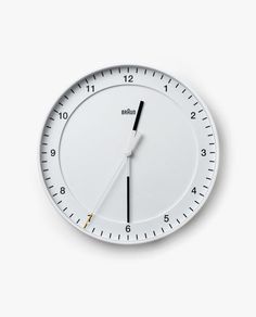 a white clock with black hands and numbers on the face is shown against a white background