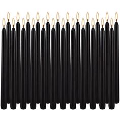 a group of black candles with gold tips