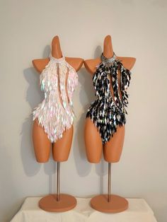 two mannequins are dressed up as flappers and dresses with sequins on them