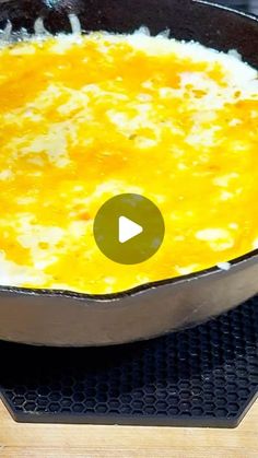 an omelet is being cooked in a skillet on a stove top with the video below it