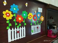 the wall is decorated with flowers and bees