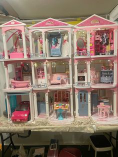 a large doll house with lots of furniture