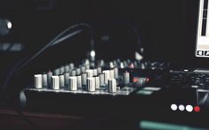 a laptop computer sitting on top of a sound board