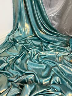 "1 mtr turquoise/gold shimmer on satin fabric This is quality fabric and is silky satin fabric It is 58\" wide (147cm) This is ideal for dress making lining,bridal dress lining, waiste coat,decorations,table runners, and many other projects If more than one quantity is bought it will be sent in one continous length All items are dispatched within one working day (Please note i try my best to get exact color of the fabric there might be a slight different in color due to different montior screens and camera lighting) Any questions feel free to ask and please take time to look at my shop" Green And Gold Fabric, Clothing Fabric Patterns, Shimmer Fabric, Dress Lining, Fabric Photography, Image Swag, Elegant Fabric, Bridal Fabric, Decorations Table