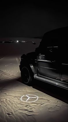 a car parked in the desert at night