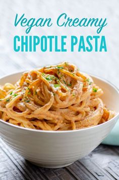 vegan creamy chipotle pasta in a white bowl on a wooden table with text overlay