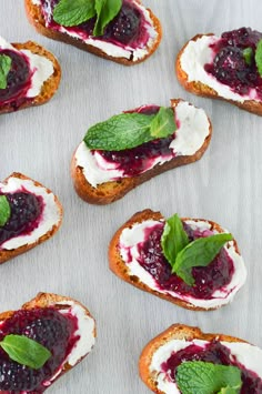 crostini with blueberry sauce and whipped cream on toasted baguettes