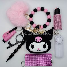 a bunch of items that are laying out on a table with some scissors and hair clips