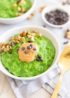 two bowls filled with guacamole and nuts