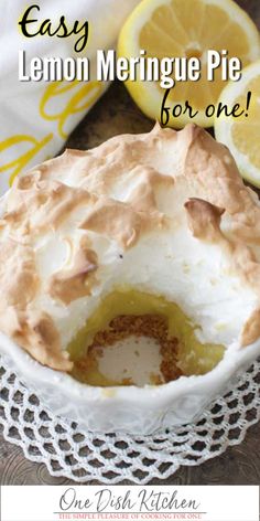 a lemon meringue pie on a doily with the words easy lemon meringue pie for one