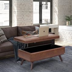 Update your space with the Owen mid-century lift-top coffee table storage ottoman. Its modern style will add a fresh-trend look to your home. It features a top that lifts up and out the lid - perfect for using your laptop, tablet, or dining and a large interior storage space. Made with solid wood and premium fabrics for stylish durability and comfort. Whether used in the living room, family room, or den, it will be the showpiece that completes the room. Simpli Home Body Fabric: Distressed Saddle Storage Ottoman Coffee Table, Large Coffee Table, Large Coffee Tables, Ottoman Coffee Table, Large Coffee, Ottoman Table, Rectangle Table