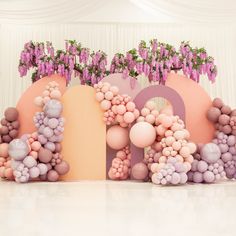 balloons are arranged in the shape of letters and flowers