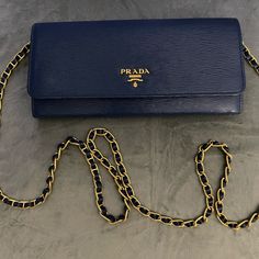 Slate Vitello Leather Prada Wallet On Chain Gold-Tone Hardware, Single Chain Link Shoulder Strap. 3 Compartment At Interior One With Zipper Compartment And 6 Cc Holders Dual Snap Closure In Front Beautiful 100% Authentic Comes With Tags And Dust Bag And Box .. Pristine Condition. Elegant Blue Wallets, Elegant Evening Blue Wallets, Elegant Blue Evening Wallets, Elegant Wallets With Chain For Daily Use, Luxury Blue Wallet For Formal Occasions, Elegant Chain Wallet For Everyday Use, Blue Clutch With Chain Strap For Formal Occasions, Blue Clutch With Chain Strap For Formal Events, Blue Formal Clutch With Chain Strap