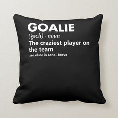 a black and white pillow with the words goalie in different languages, on it