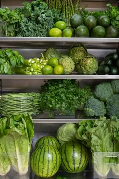 many different types of fruits and vegetables on shelves