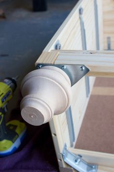 a close up of a door handle with a shoe on the ground next to it