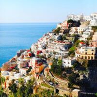 an aerial view of a city on the edge of a cliff