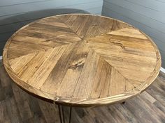 a wooden table sitting on top of a hard wood floor