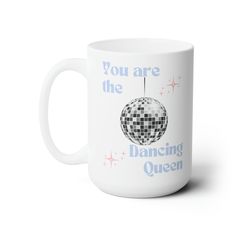 a white coffee mug with the words you are the dancing queen on it's side