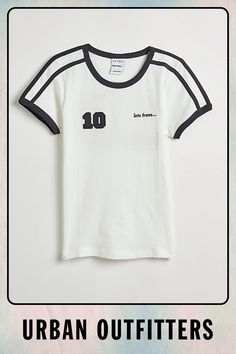 iets frans... soccer ringer baby tee. Shrunken fit baby tee from iets frans... with vintage vibe sport graphics. Ringer style tee with a fitted silhouette that's cropped above the waist in a soft and stretchy knit. Find this iets frans... tee only at Urban Outfitters. Features iets frans... soccer ringer baby tee Vintage style sporty graphic tee Shrunken tee with a cropped fit UO exclusive Content + Care 100% Cotton Machine wash Imported Size + Fit Model is 5’11" and wearing size Medium Measurem White Collegiate T-shirt With Three Stripes, Vintage Sports Tops For Football Season, White Retro Tops For Sports Season, White Retro T-shirt For Sports Season, Retro White T-shirt For Sports Season, Retro White Top With Team Name, Retro White Tops With Team Name, White College T-shirt With Three Stripes, White T-shirt With Three Stripes