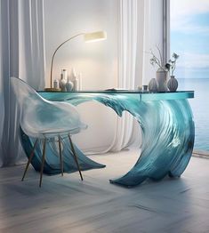 a table with a glass top that looks like a wave in the ocean is next to a white chair