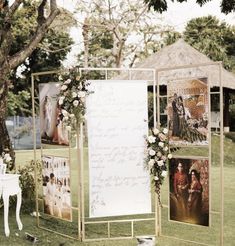 an outdoor ceremony setup with pictures and flowers