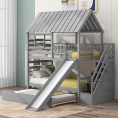 a child's bunk bed with a slide in front of it