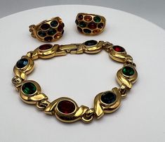 "Vintage Joan Rivers clip on earrings and matching bracelet. They are gold tone metal with multicolor crystals. Clips singed Joan Rivers, bracelet  not singed. In very good condition. Measures: Bracelet 7.5\"x0.5\", clip on earrings 1\" x0.75\" Please keep mind each electronic device has different resolution, brightness and clarity. Therefore products might have slight difference of shade/tone/color in person. Please see my other listings and thanks for shopping." Vintage Red Jewelry With Jubilee Bracelet, Vintage Gold Clip-on Jewelry, Joan Rivers Jewelry Vintage, Vintage Jeweled Metal Clip-on Earrings, Joan Rivers Jewelry, Vintage Gold-tone Metal Charm Bracelet, Joan Rivers, Vintage Clip, Electronic Devices