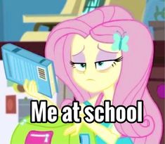 a pinkie is holding a book with the words me at school