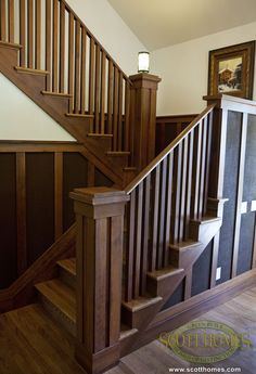 a wooden staircase leading up to the second floor